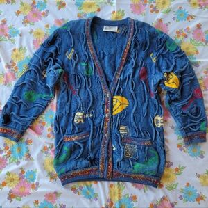 COOGI Blue Knit Sweater with Multicolor Music Instruments